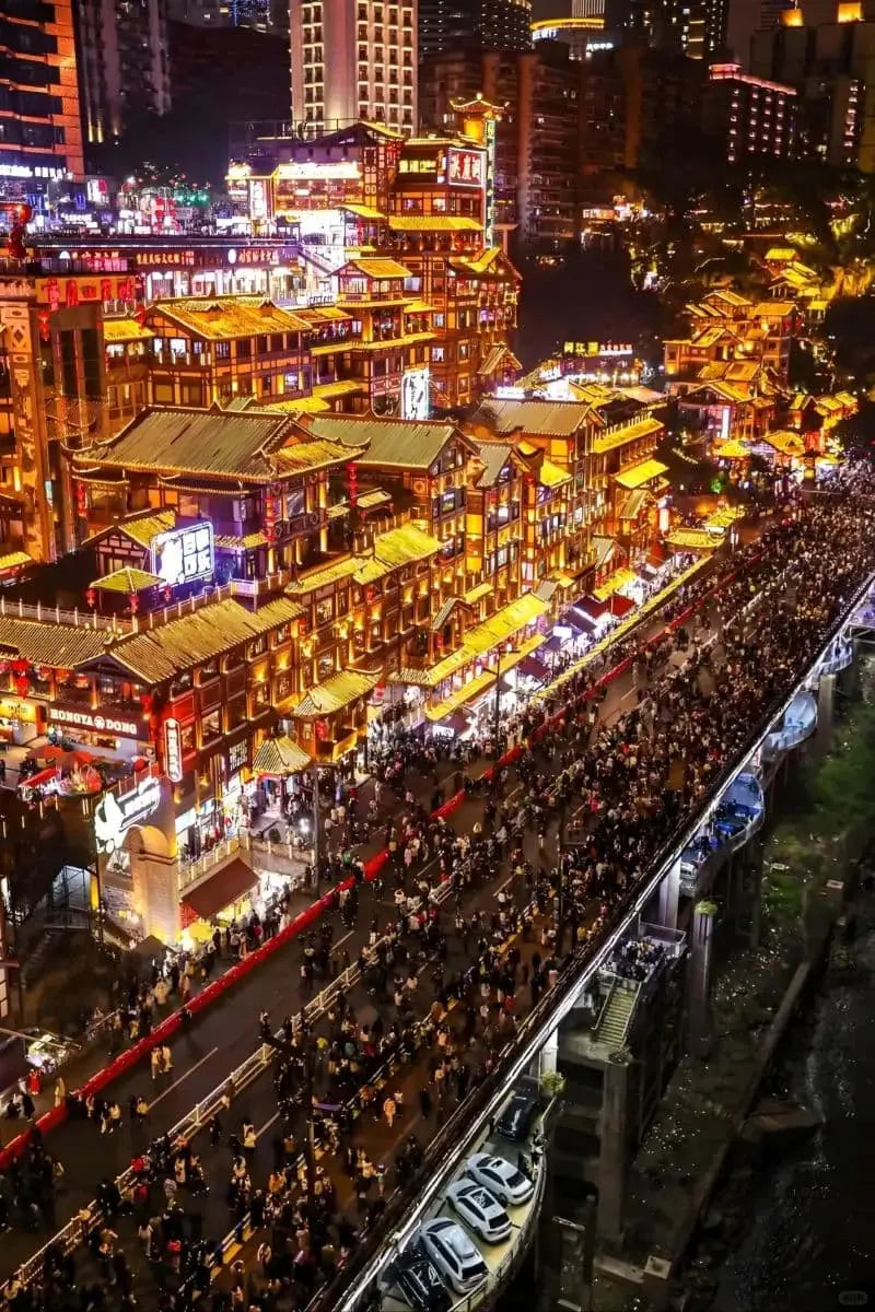 Chongqing's vibrant night scene showcasing illuminated buildings and bustling streets during the private all-inclusive tour.