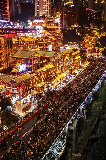 Chongqing's vibrant night scene showcasing illuminated buildings and bustling streets during the private all-inclusive tour.