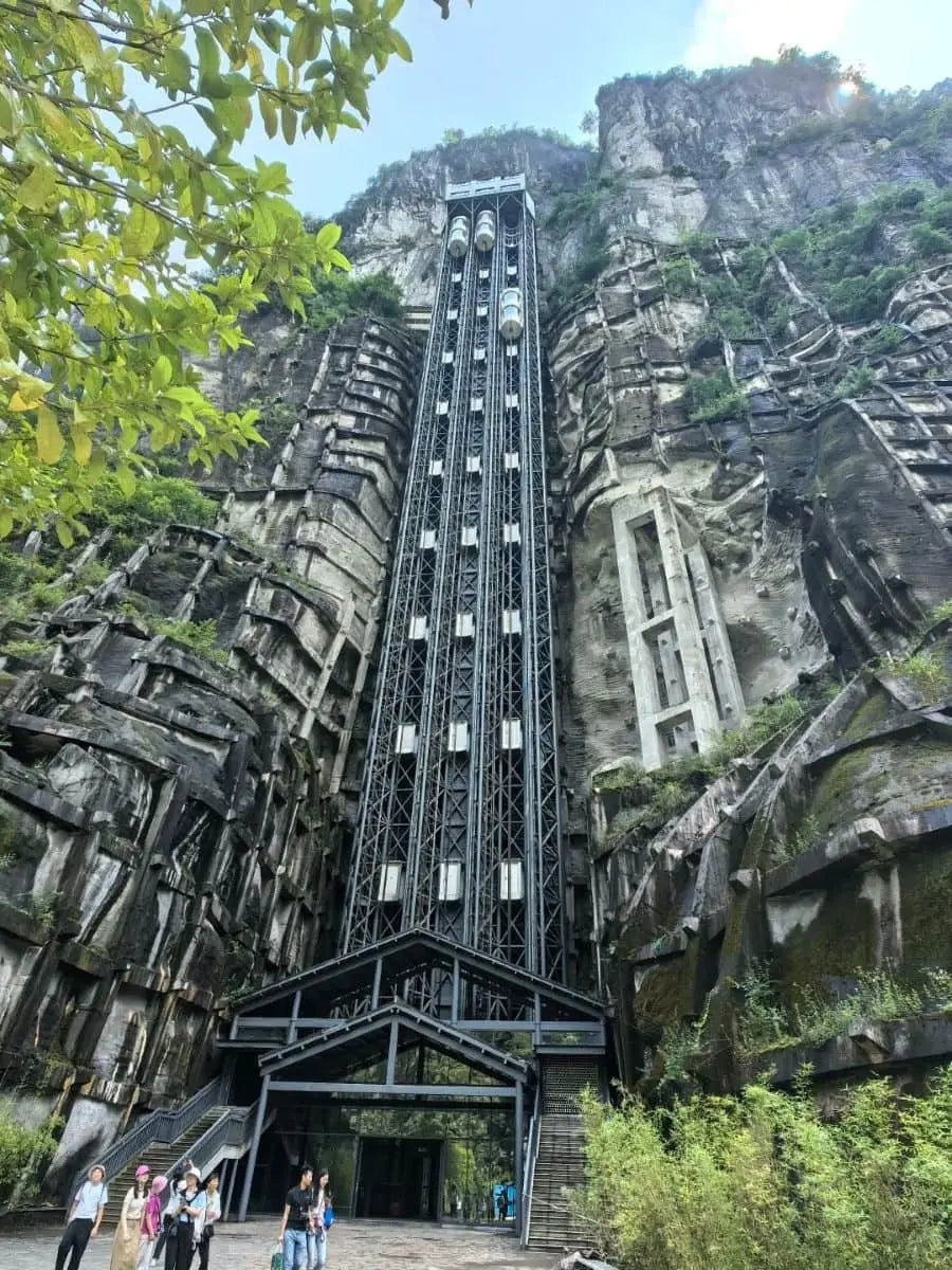 Elevator surrounded by rocky landscape in Chongqing, China, showcasing unique geological formations.